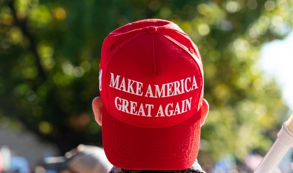 Unidentified man with a backward "MAGA" red Trump hat